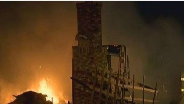 brick fireplace still remaining after the explosion and fire